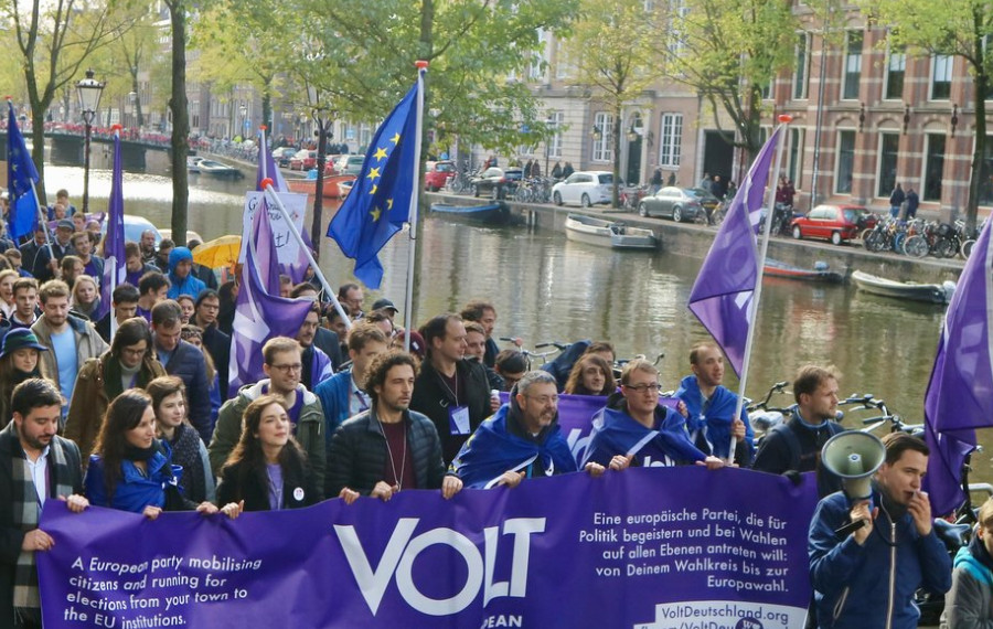 Volt parade in Amsterdam with flag