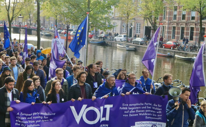 Volt parade in Amsterdam with flag